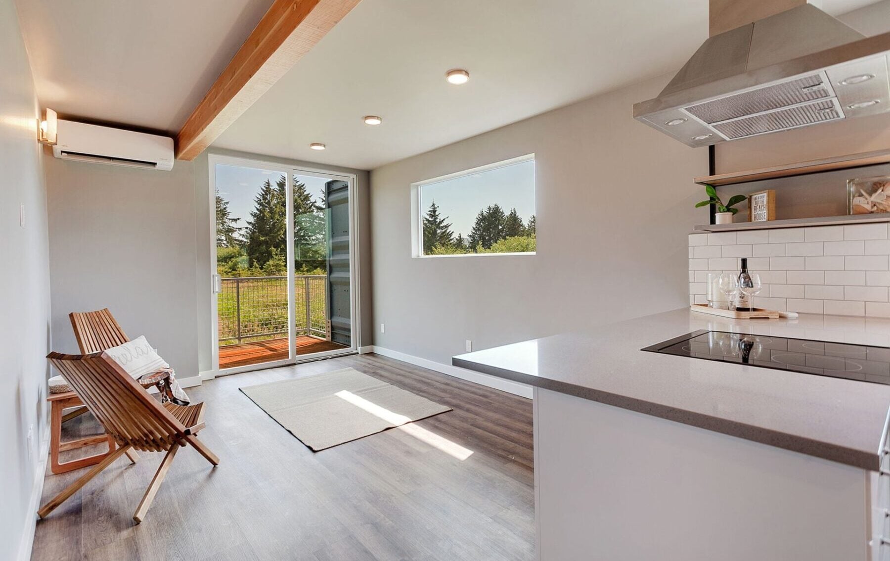 Modern shipping container home interior featuring sustainable materials, modular design, and open layout for eco-friendly living.