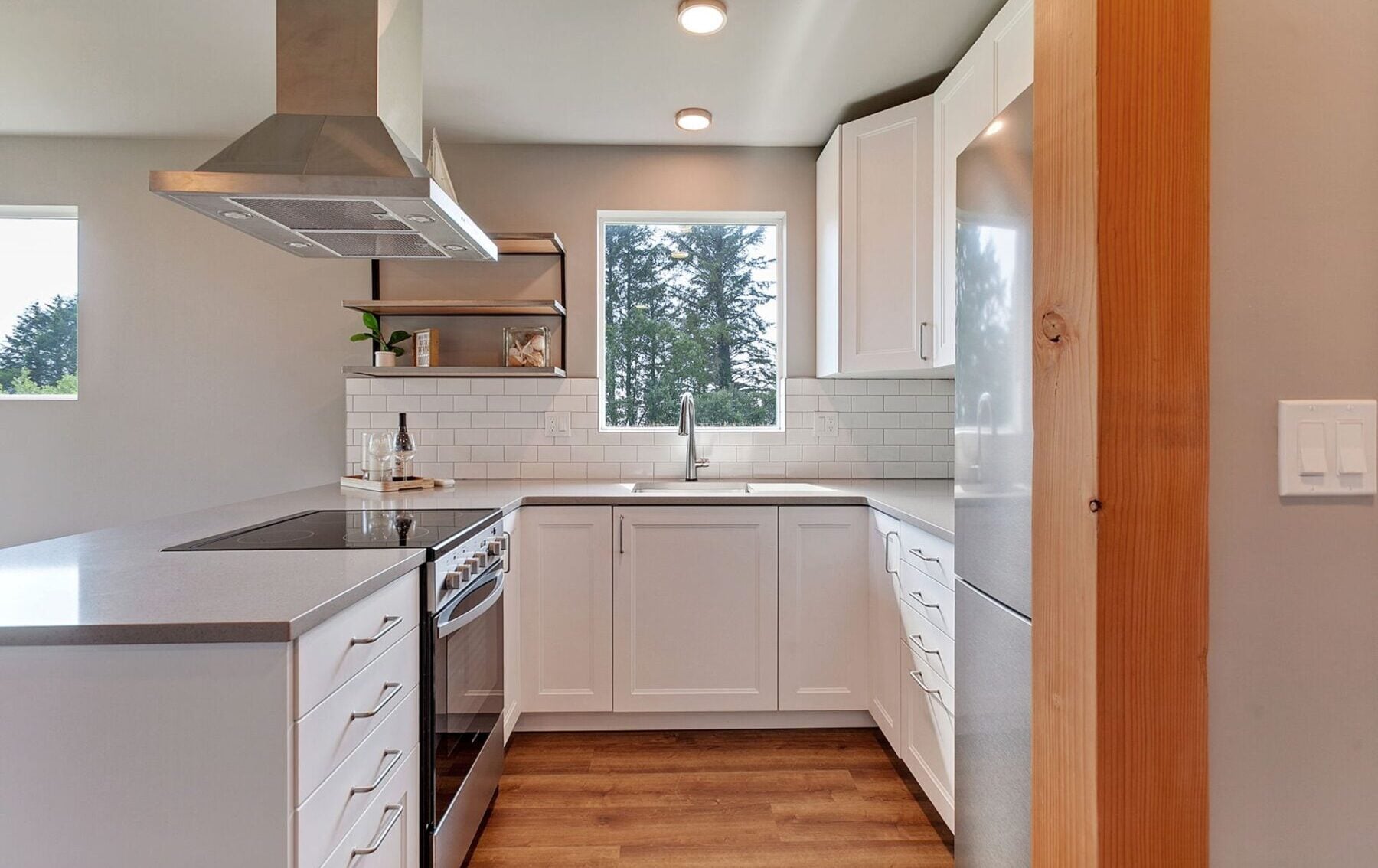 Modern shipping container kitchen featuring sustainable materials, sleek cabinets, and eco-friendly design for modular homes.